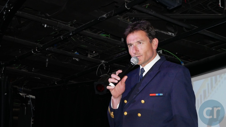 The Captain greets guests in the theater