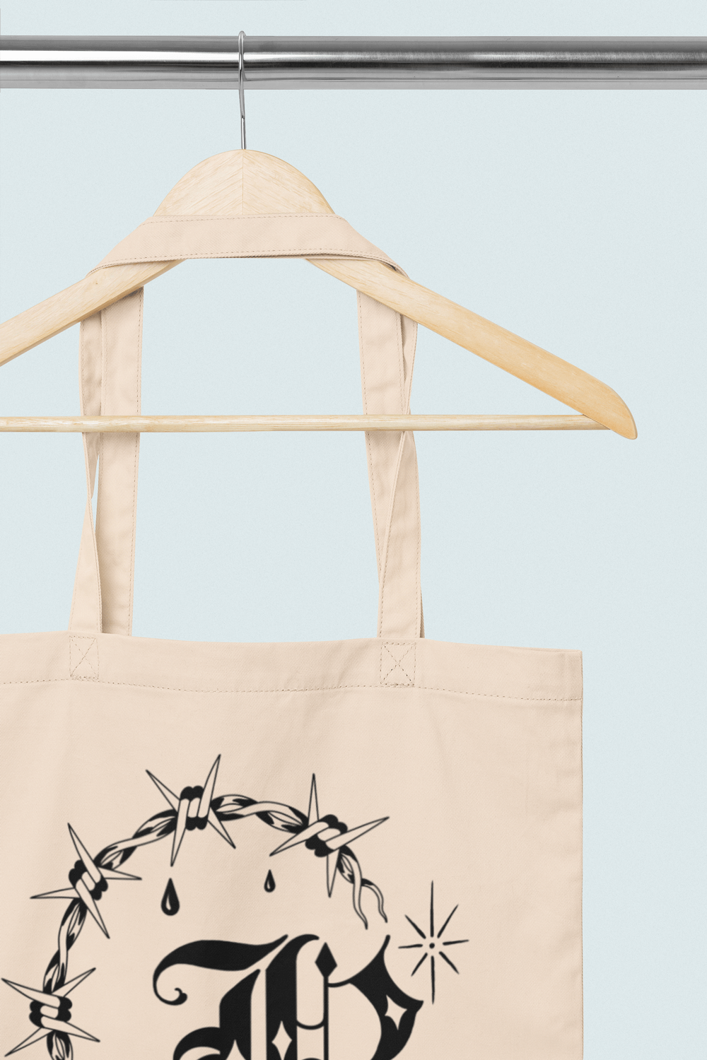 Close up of top of tote and straps for John Reardon's tattoo tote