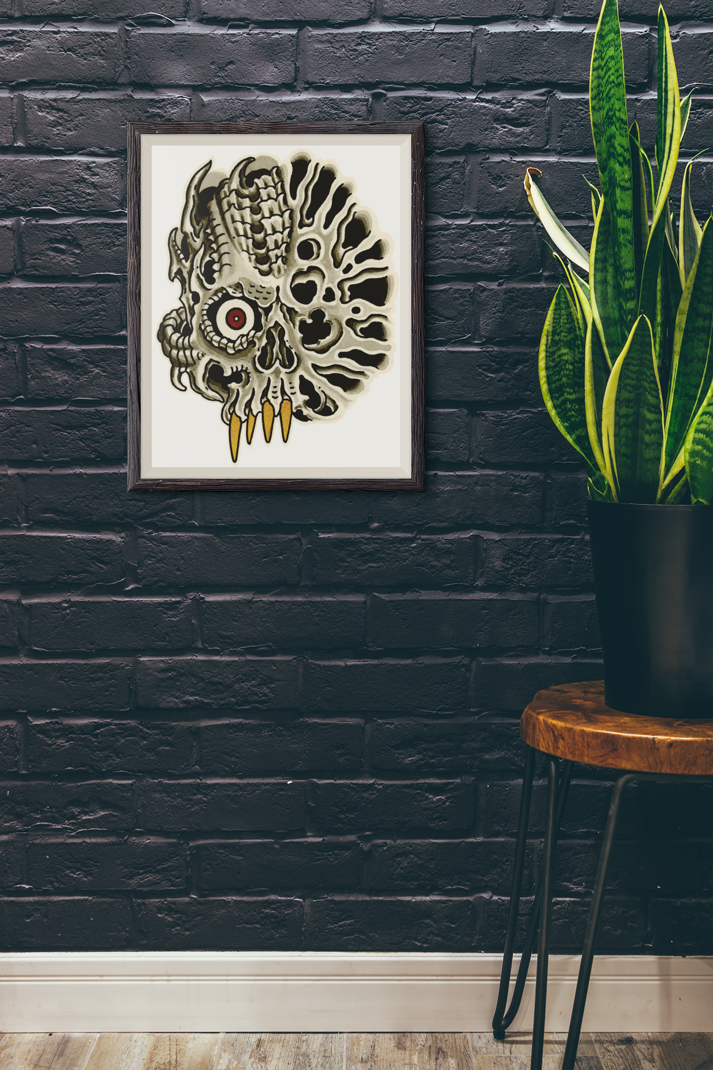Biomechanical skull tattoo design painting by John Reardon and hung on a black brick wall.