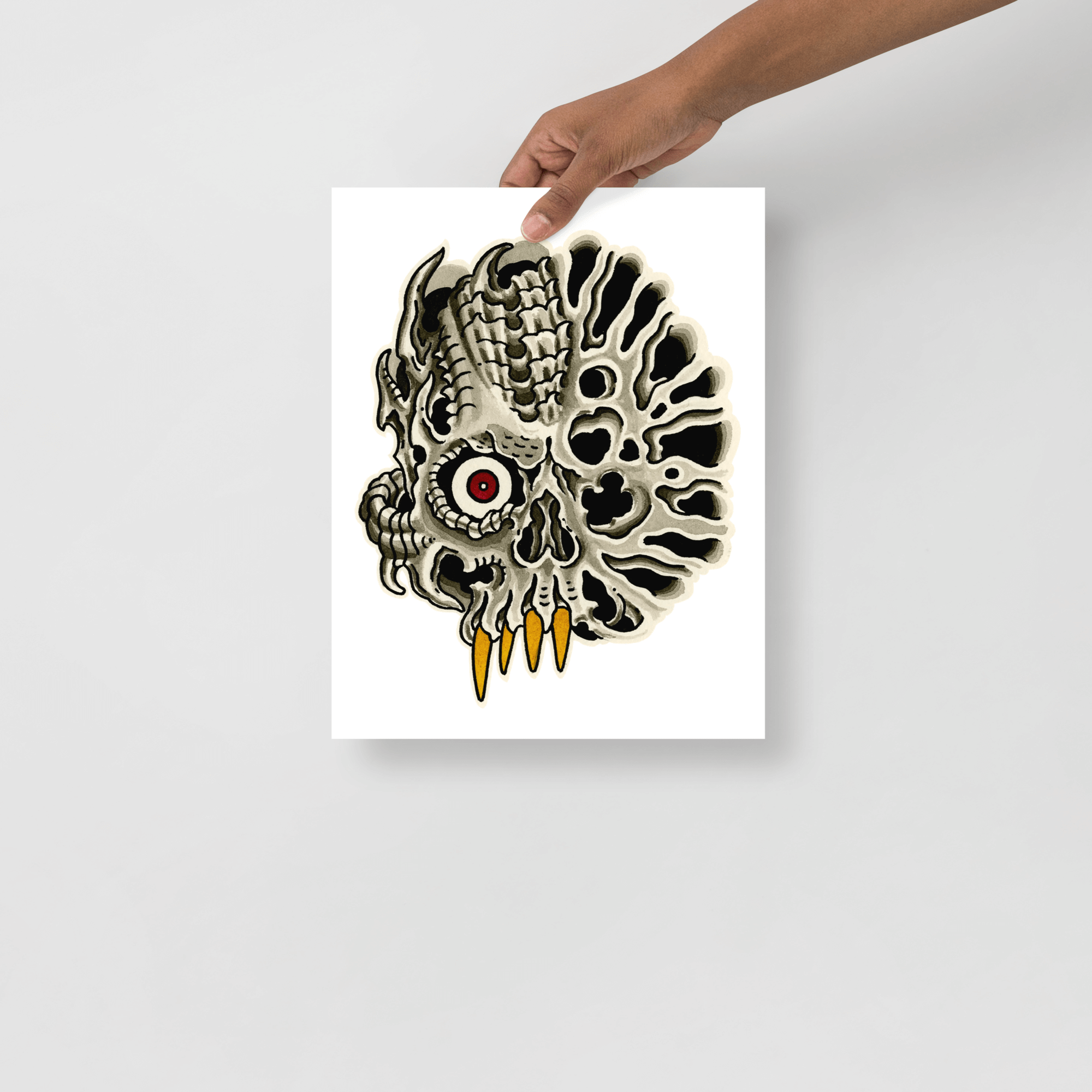 11x14 size print of tattoo design by John Reardon held in front of a grey wall.