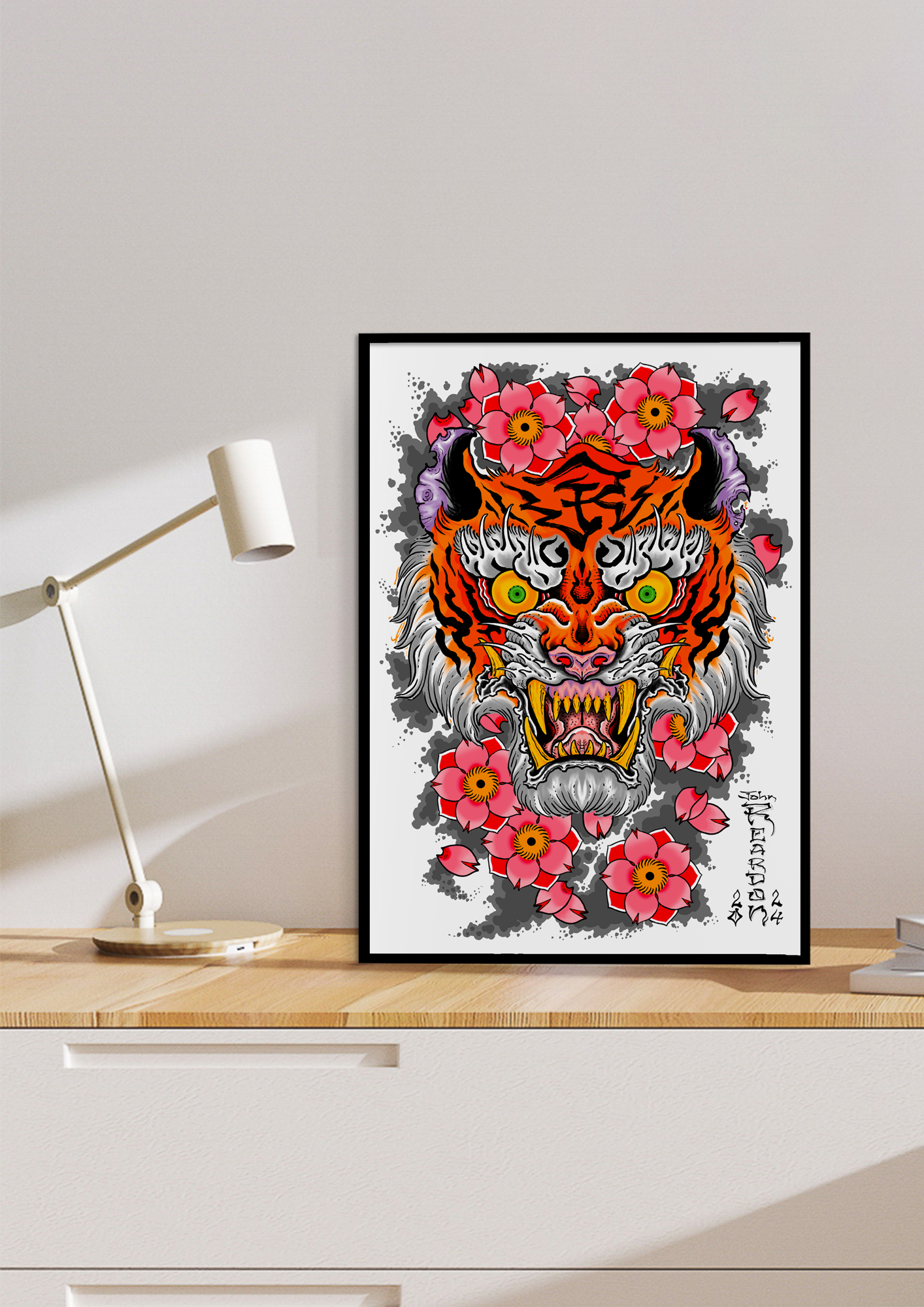 Wood desk with white desk lamp and tiger and flowers print in a black frame - frame not included.