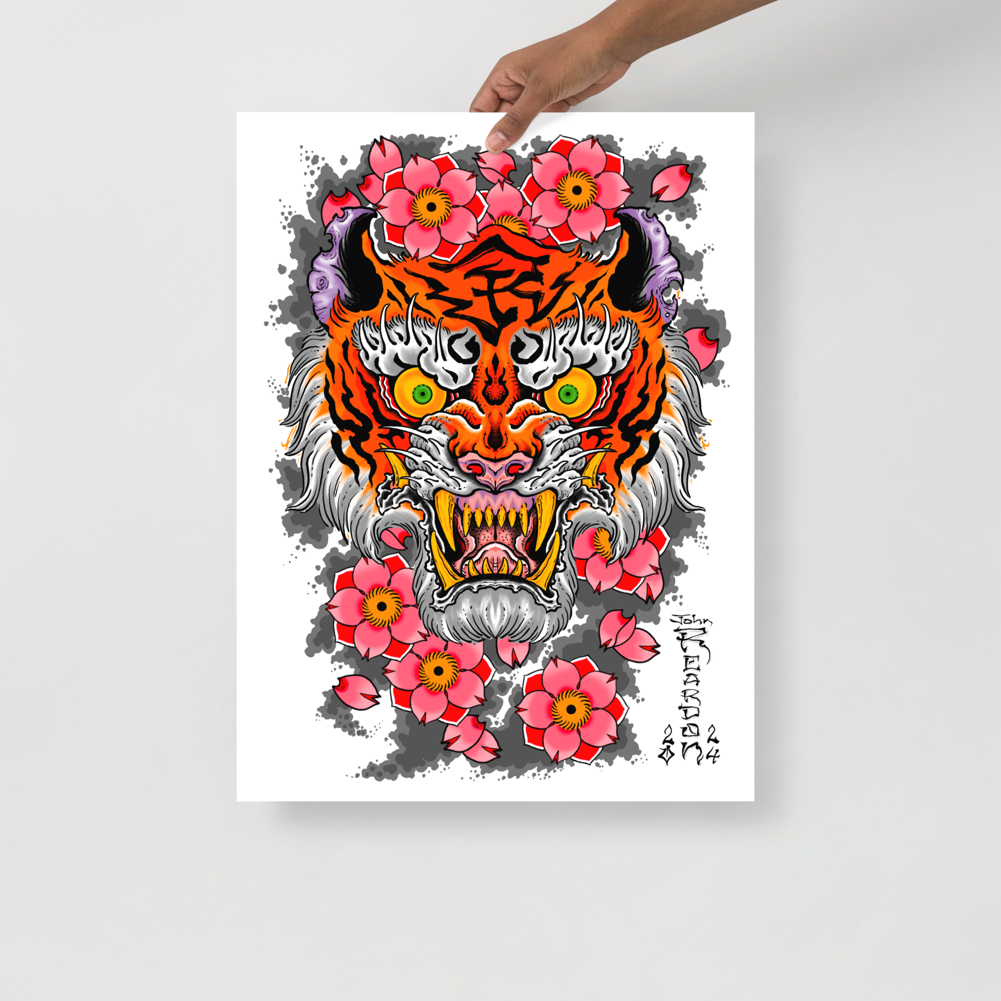 Color poster of a tiger being held by someone with hand