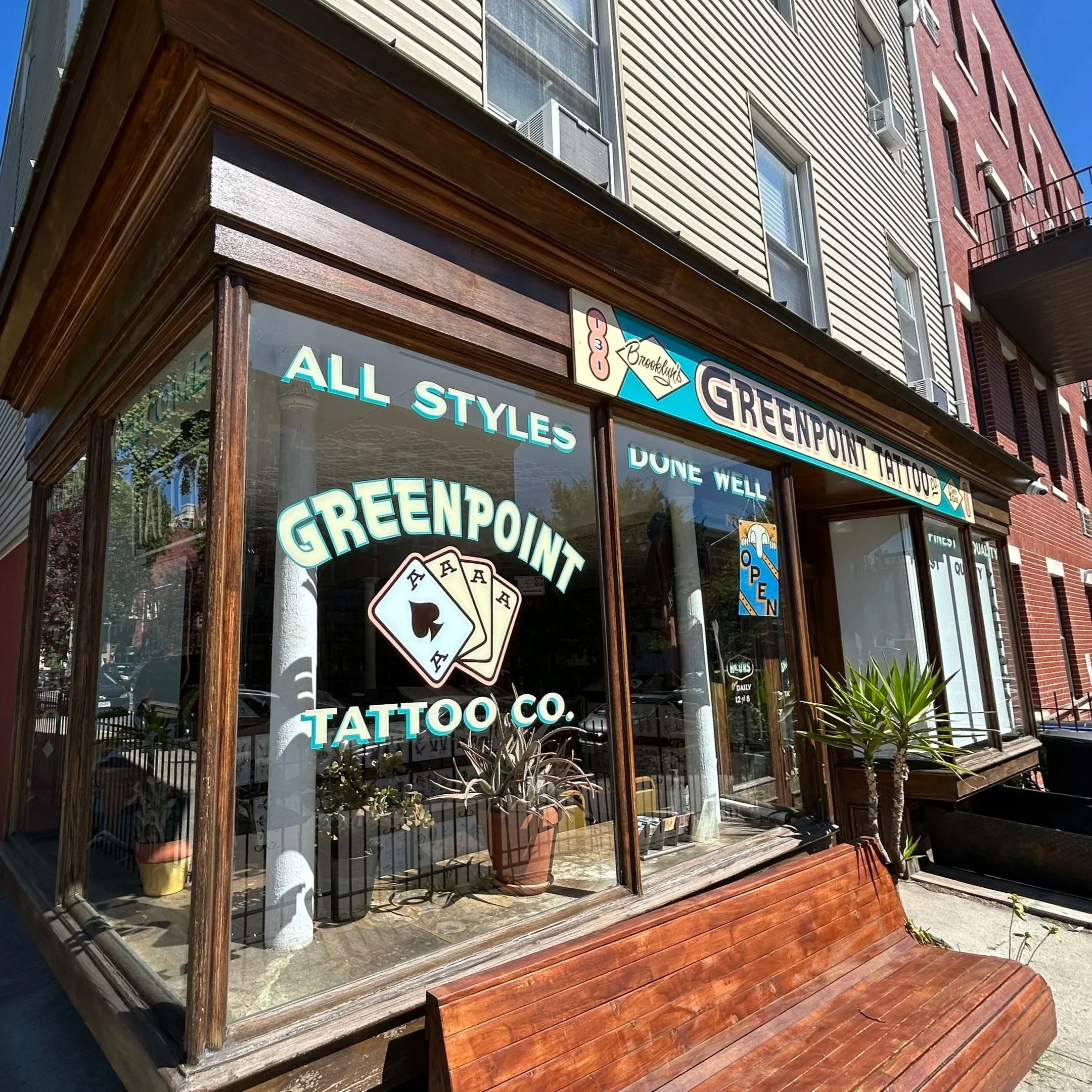 Greenpoint Tattoo Co shop in Brooklyn New York on a very sunny day.