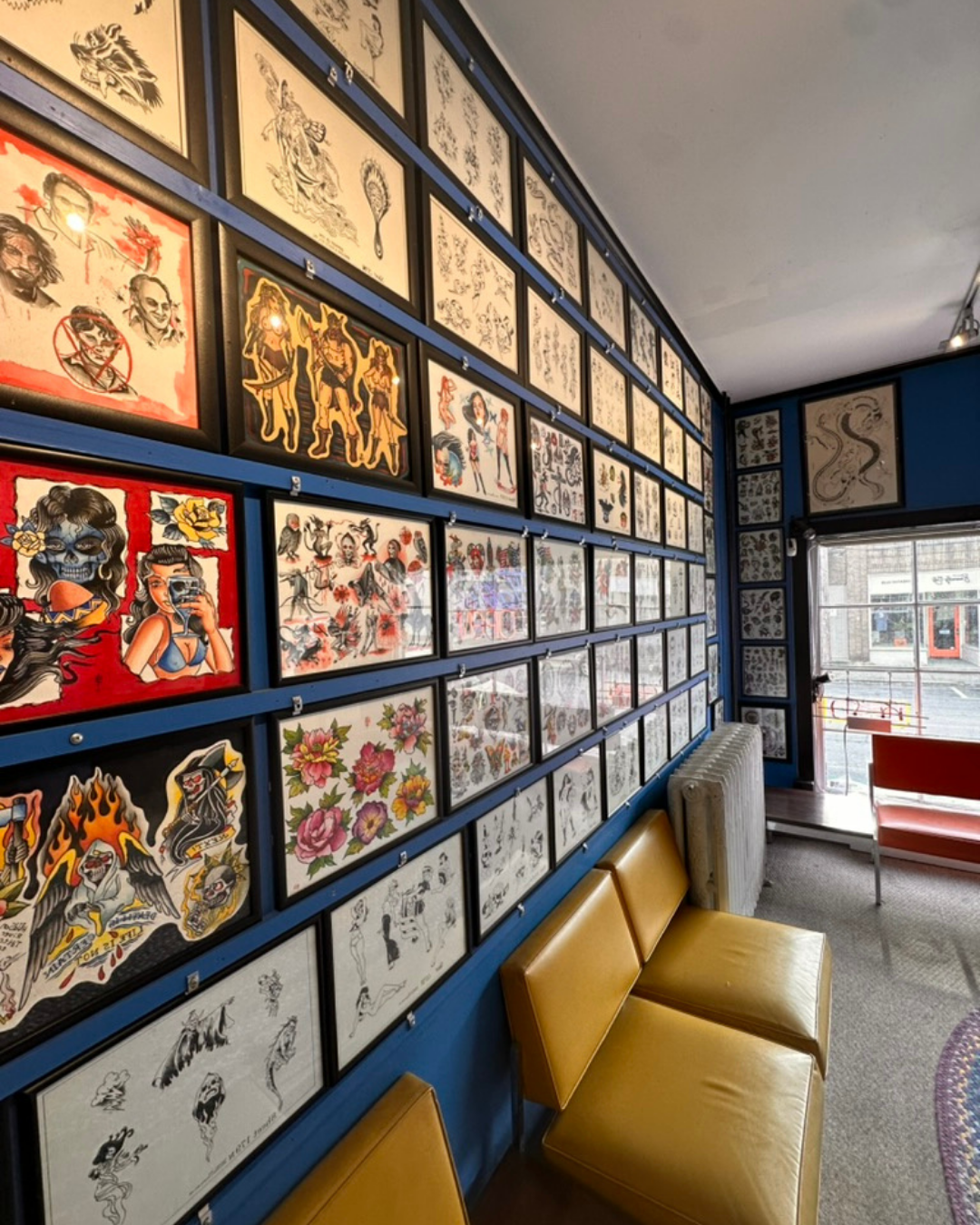 Inside view of the Hudson New York tattoo shop flash wall.