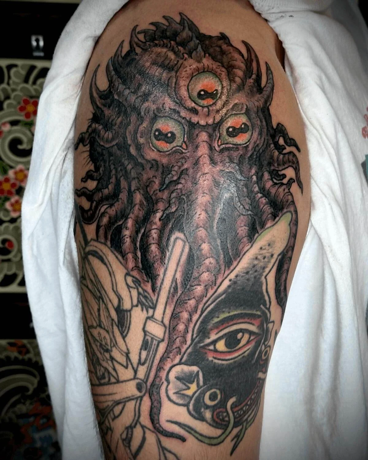 Biomech creature tattooed in color by John Reardon in Greenpoint Brooklyn.