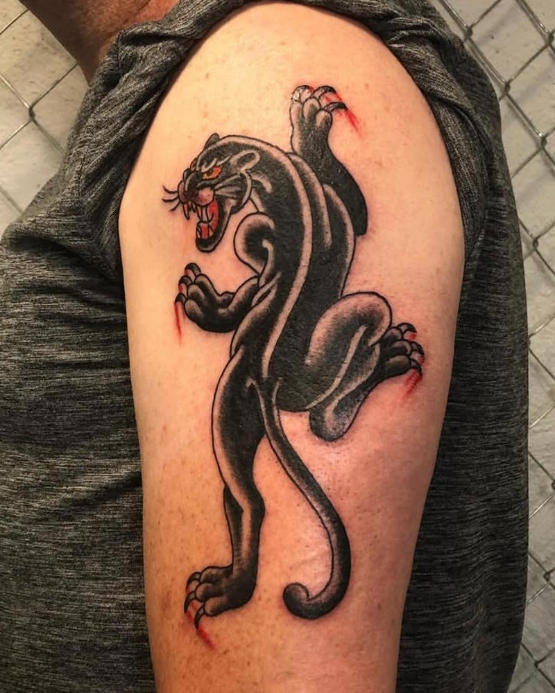 Traditional black panther tattoo on upper shoulde done in NYC.