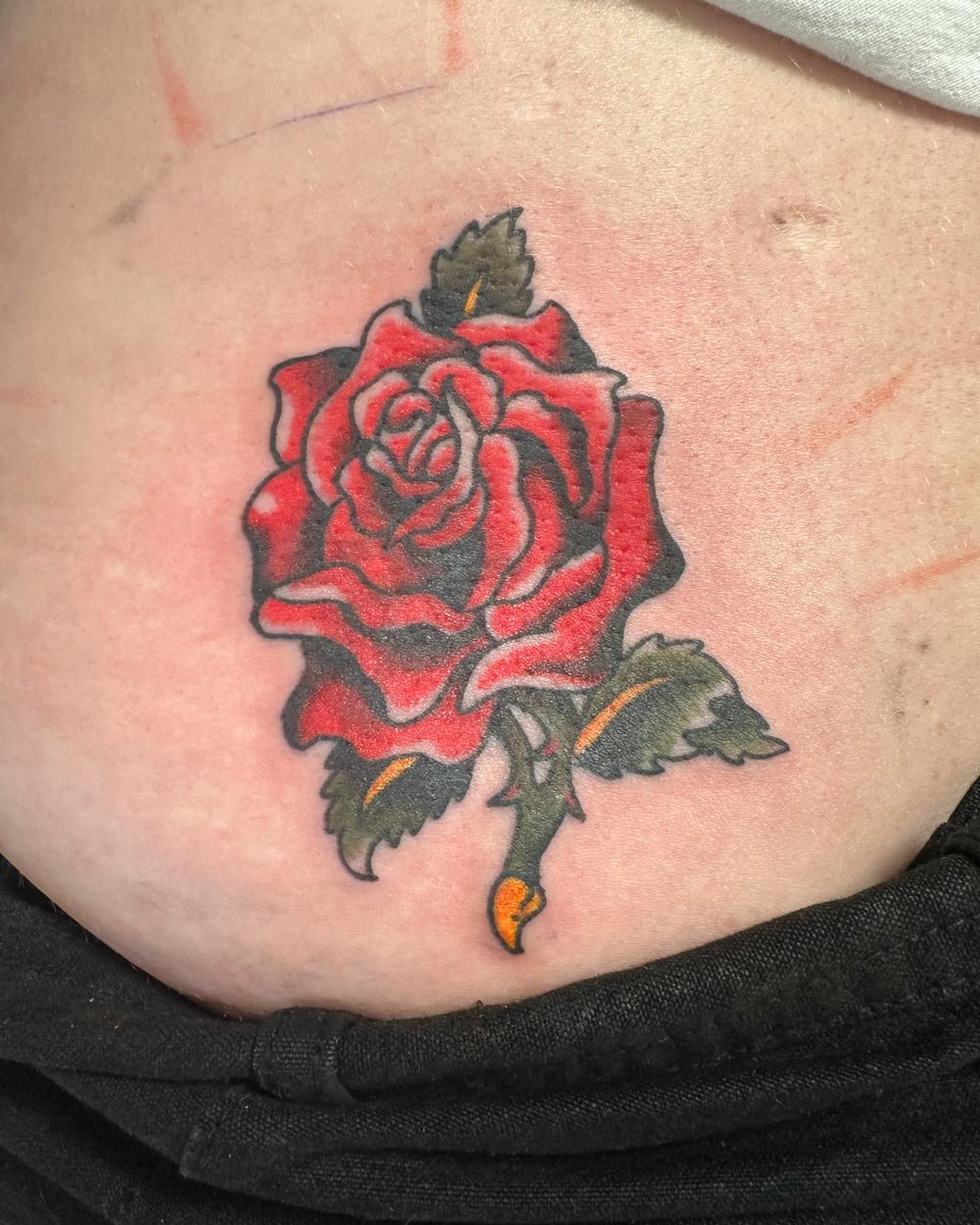 Color rose tattoo coverup.