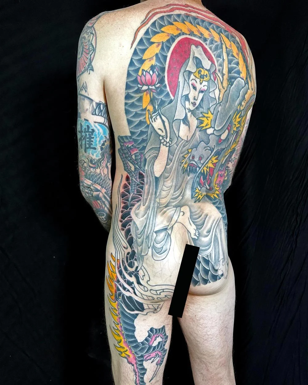 Deity and dragon tattoo as a full color backpiece done in Brooklyn NY.
