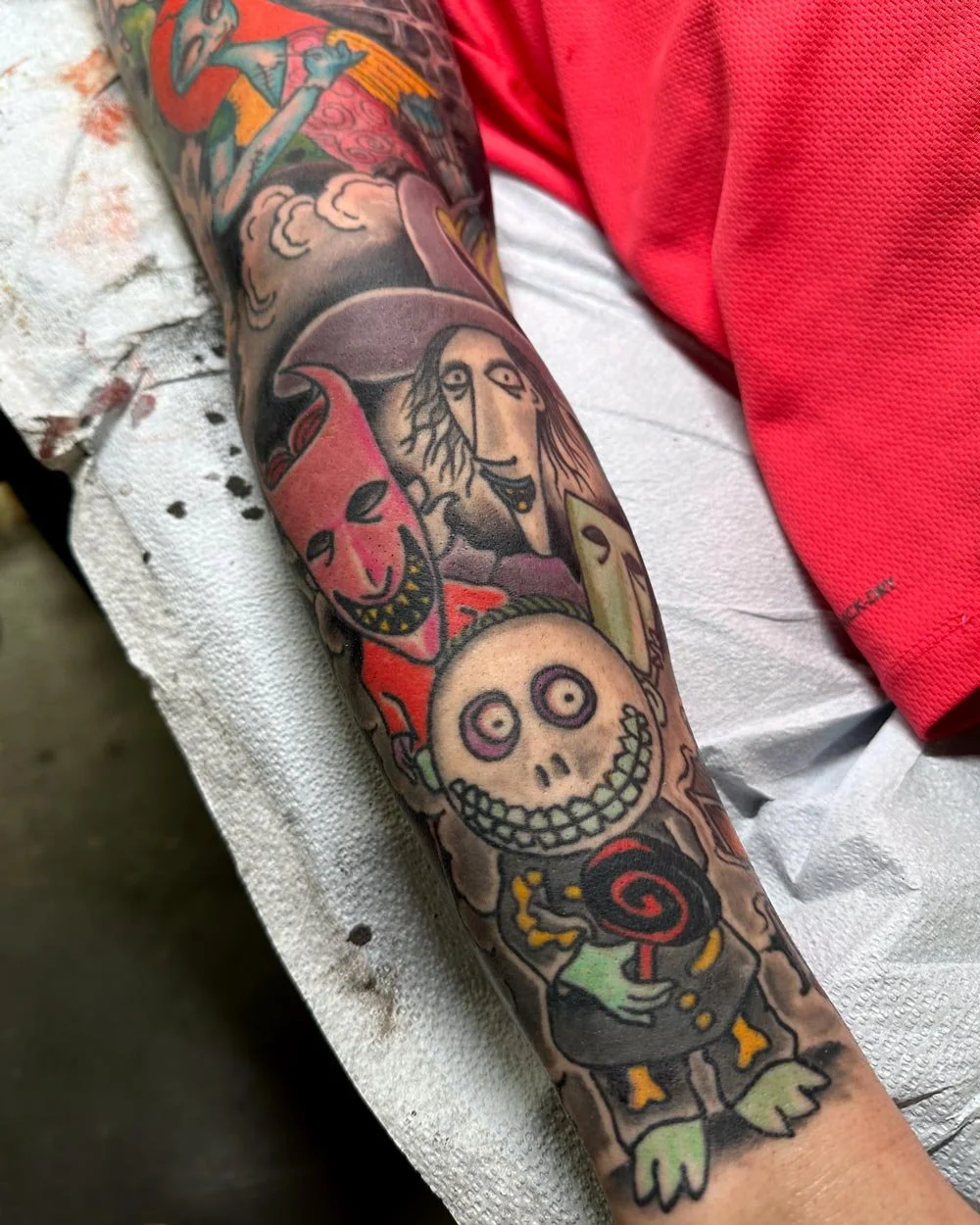 Full color tattoo sleeve of Nightmare Before Christmas characters.