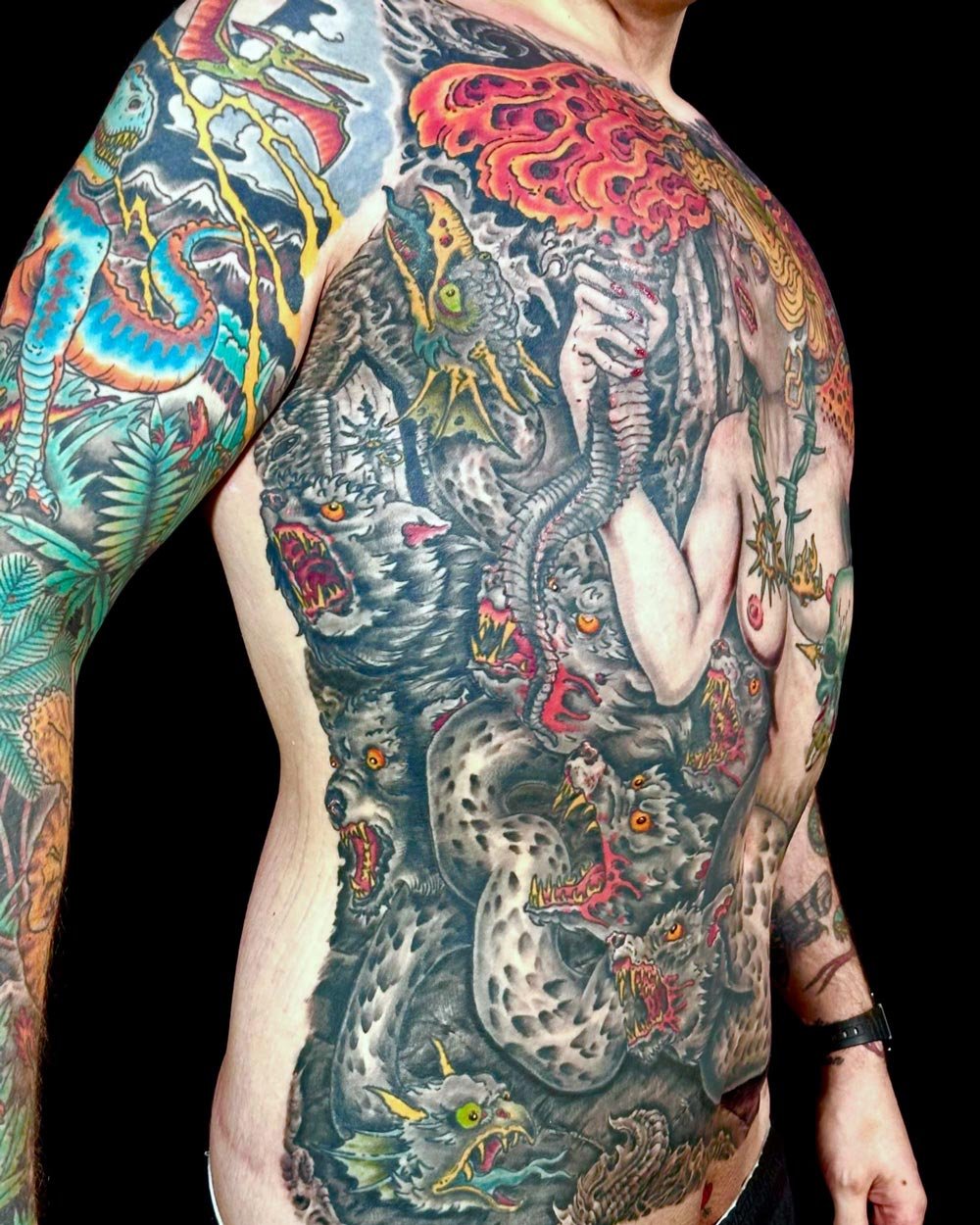 Side view of the rib area of a full front color tattoo.