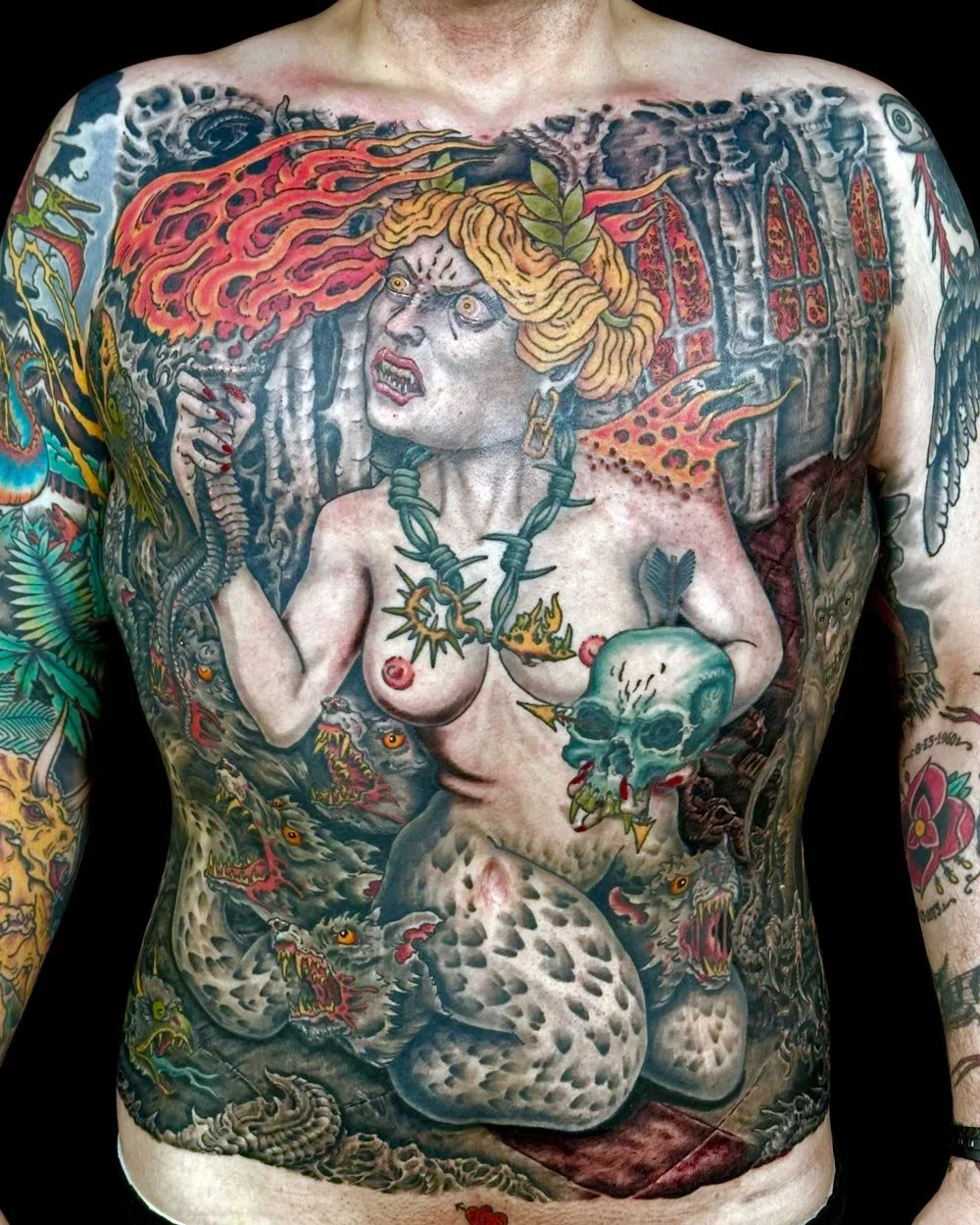 Full front tattoo and healed sleeves in color by John Reardon.