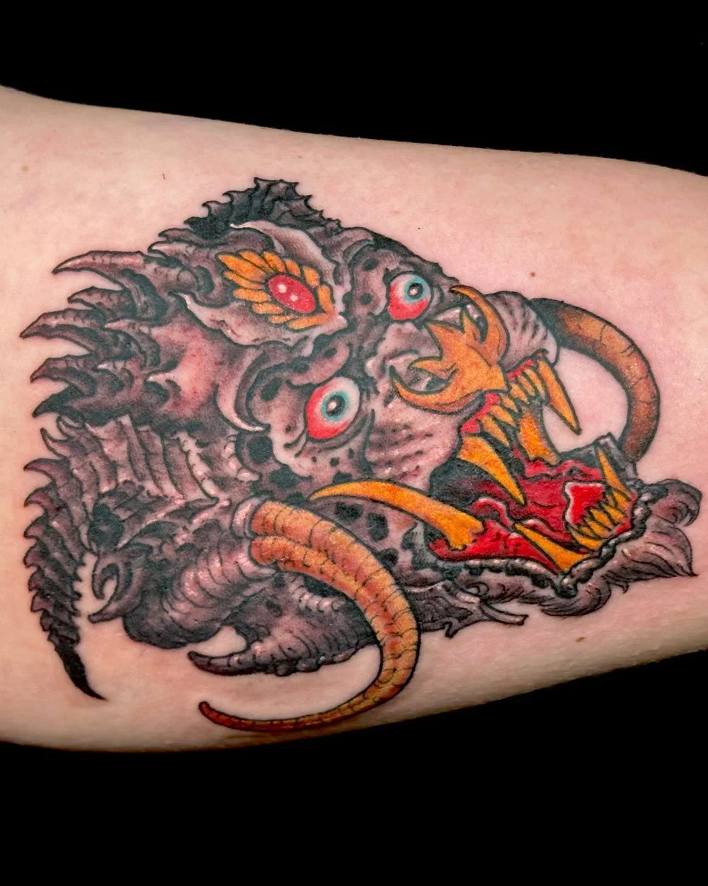 Monkey King tattoo on inner upper arm in color by John Reardon.