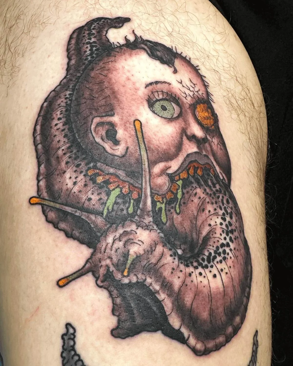 Sci-fi color tattoo of a snail with a doll head as a shell.