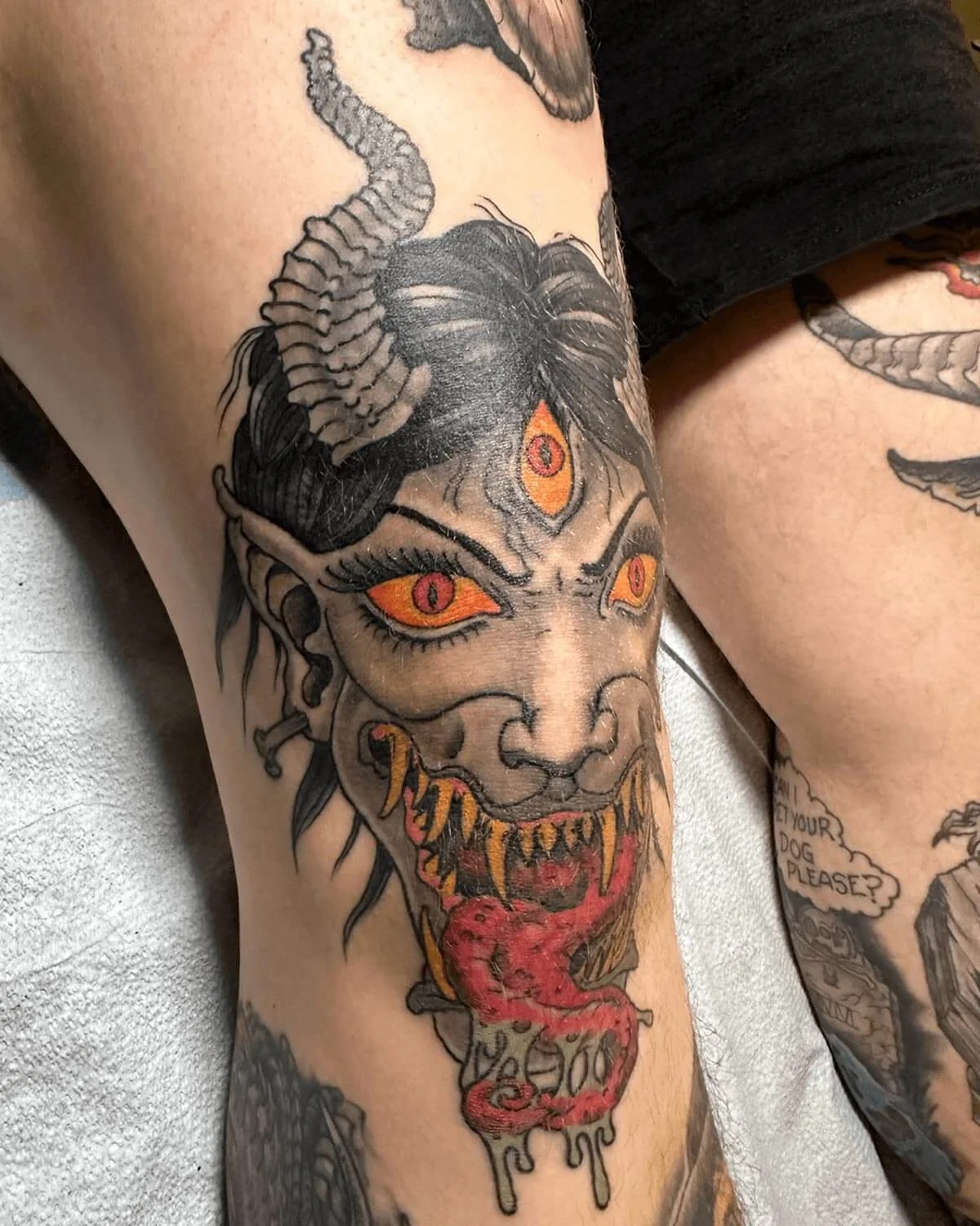 Side-view of a demon tattoo done in color by John Reardon.