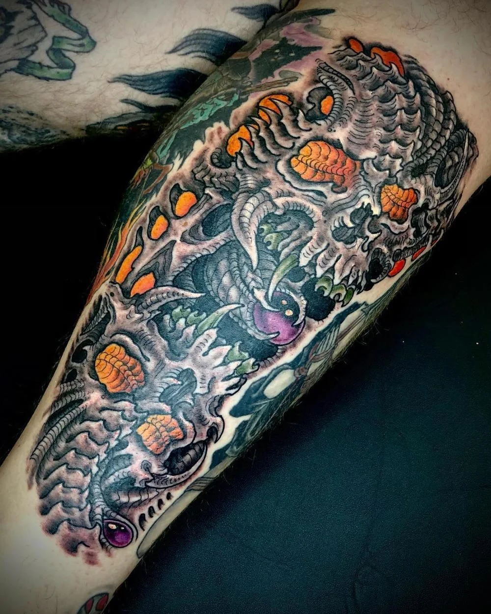 Stacked biomech skull tattoo custom designed by John Reardon.