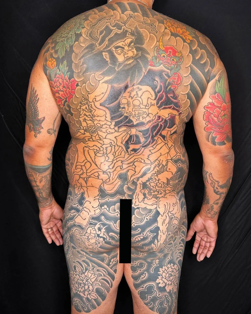 Full back piece of a samurai fighting in color.