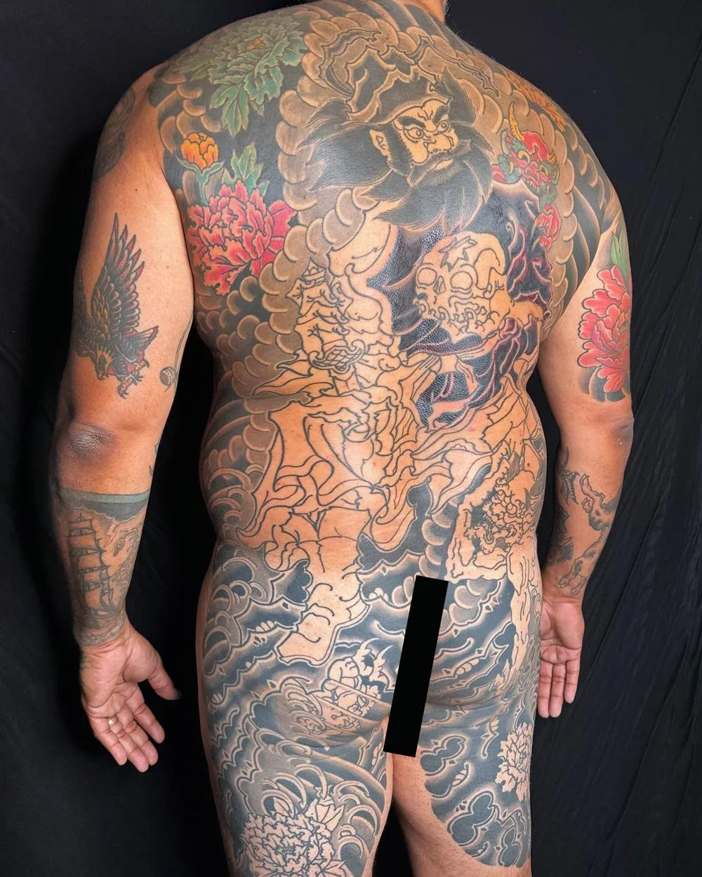 Side view of a samurai tattoo on a back.