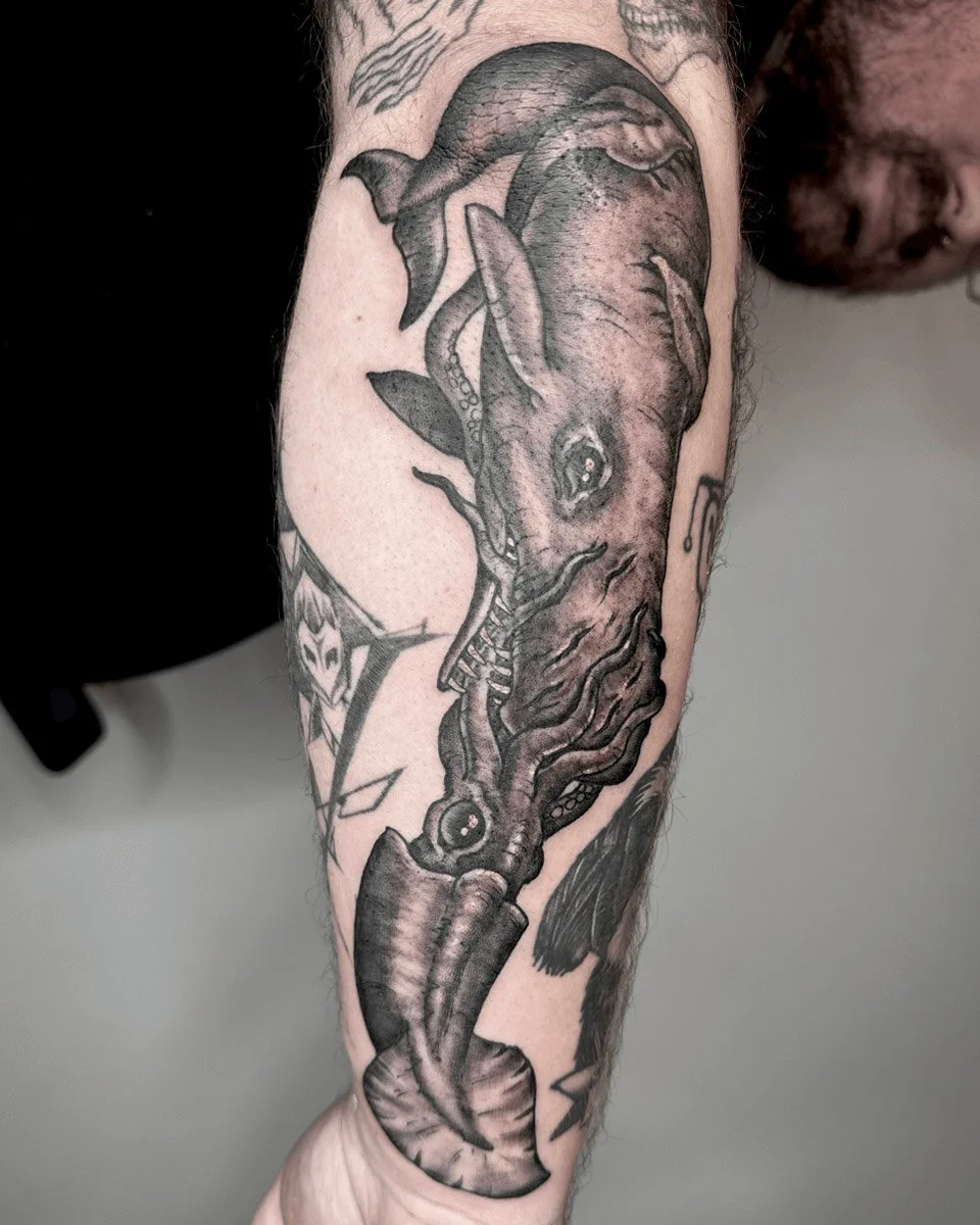 Whale fighting a squid black and grey tattoo designed by John Reardon in fine-line style.
