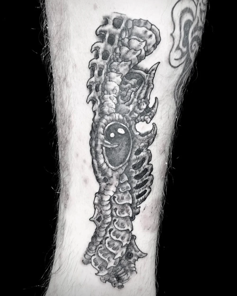 Black and grey biomech tattoo drawn on custom by artis John Reardon.