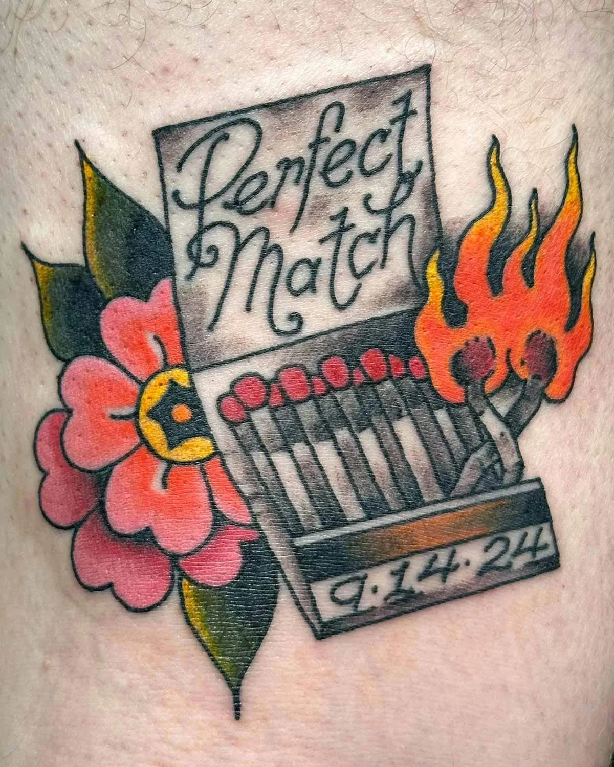 Matchbook tattoo with matches on fire and a flower in the back.