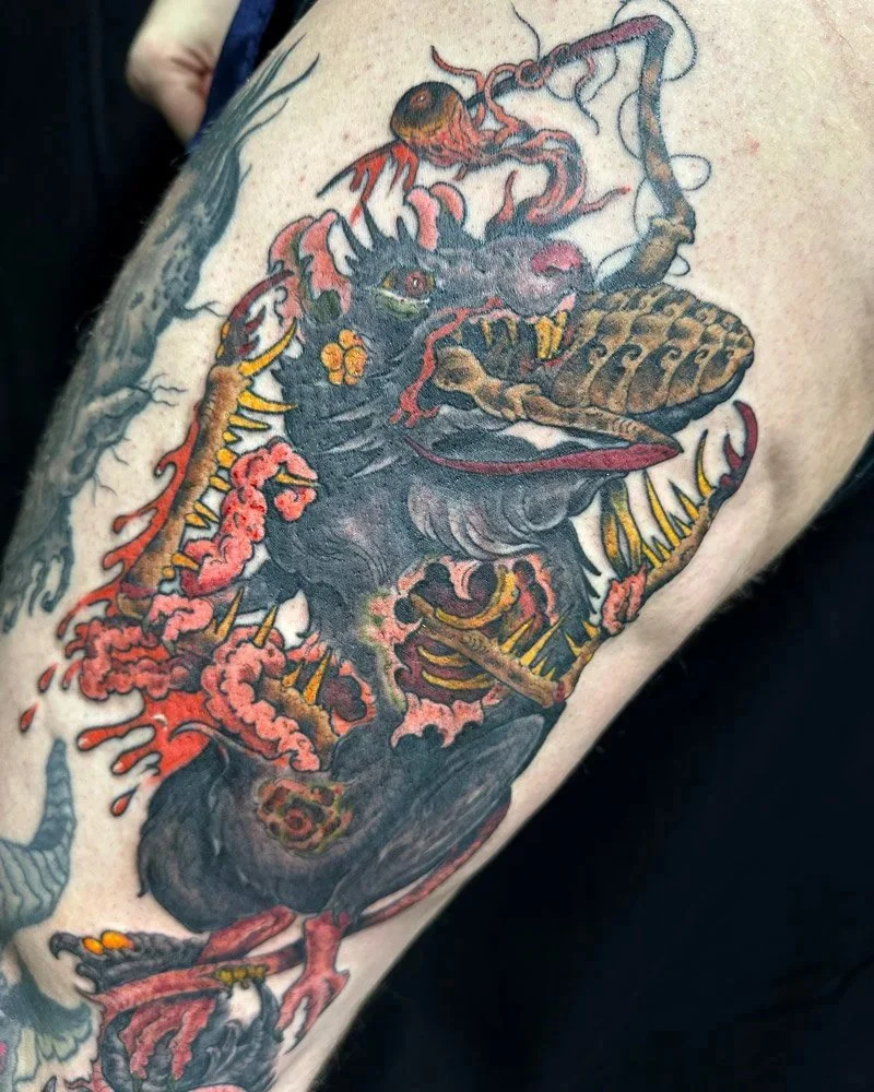 Color tattoo of a rat fighting a cockroach on an upper thigh, tattooed in Greenpoint, Brooklyn, NY.