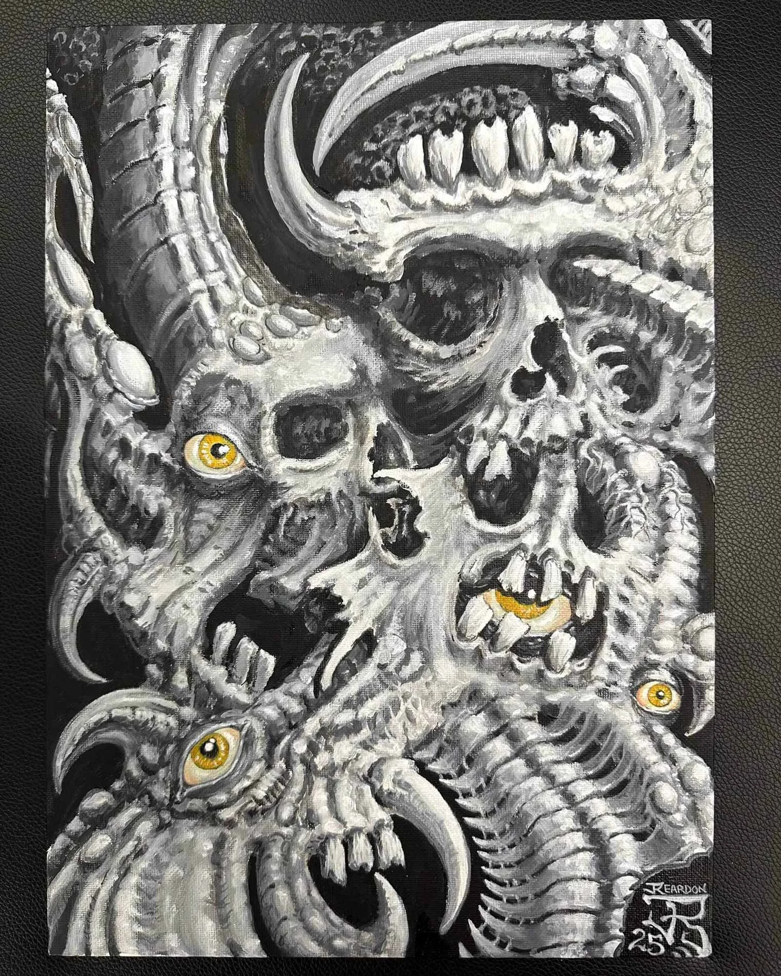 Black and grey bio-mech skulls with yellow eyes original painting by John Reardon.