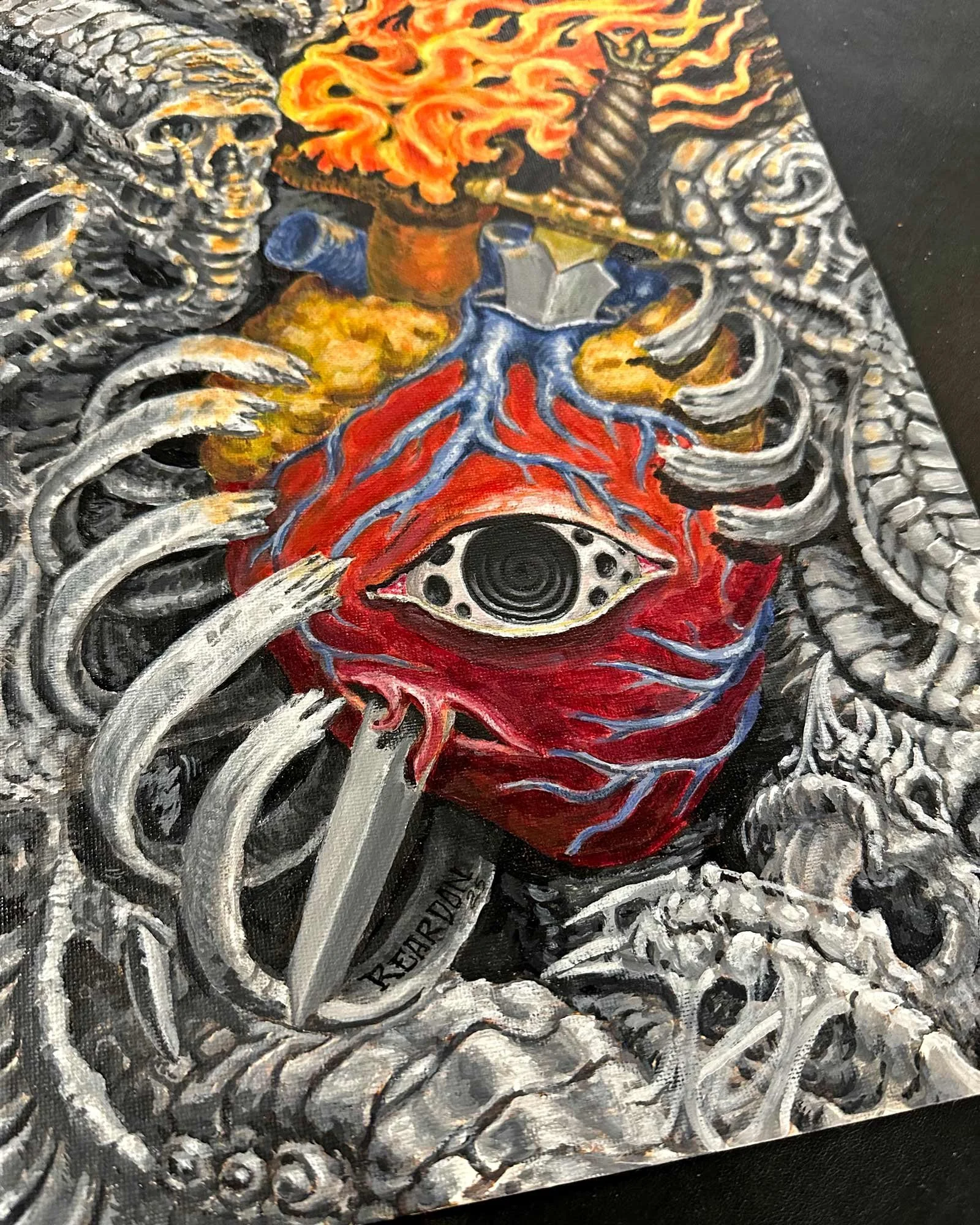 Tilted original painting by John Reardon of a color flaming heart being stabbed by a sword inside a black and grey bio-mech chest with snake.