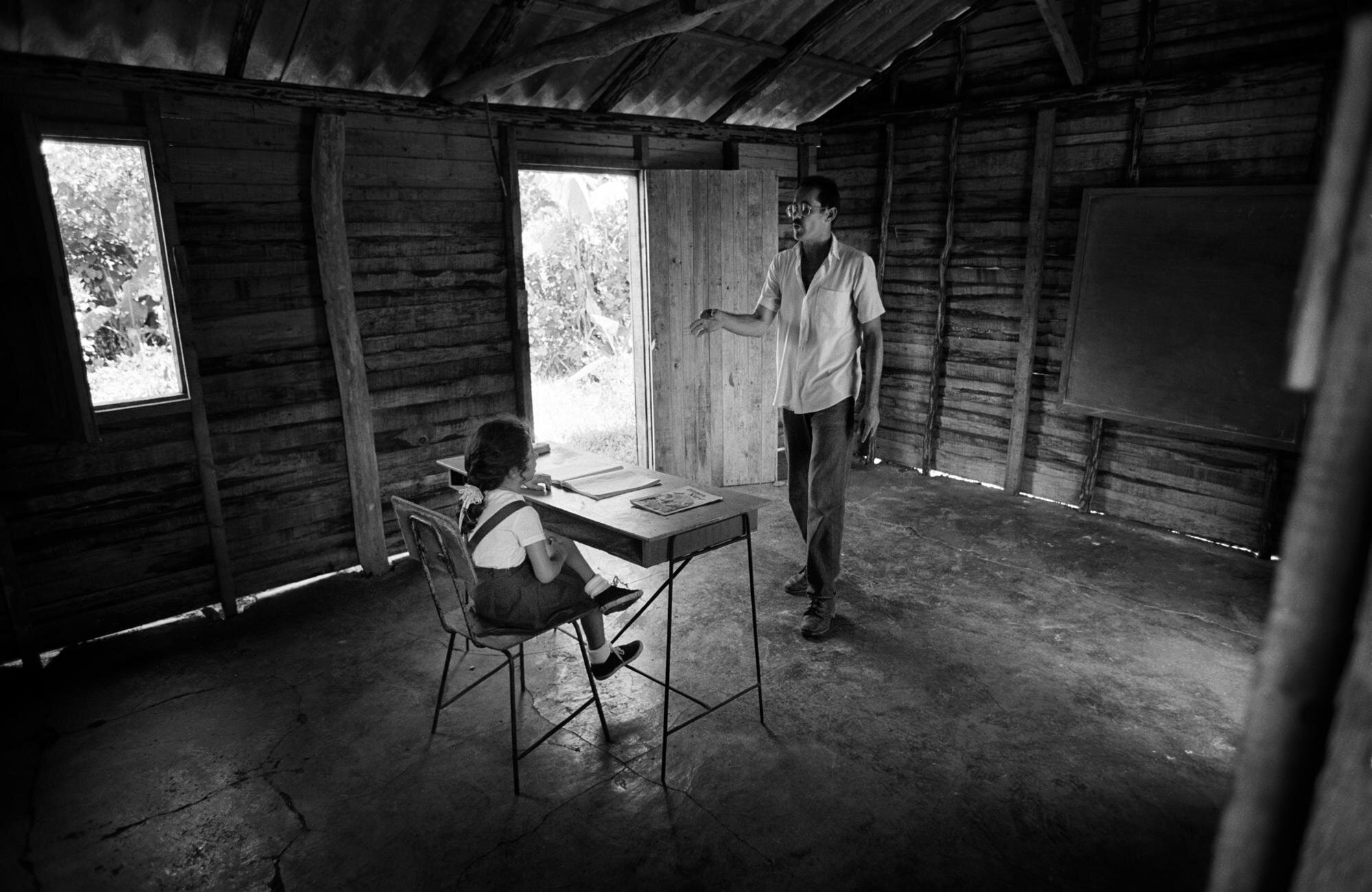  First grader DARITZA GONZALEZ, 6 years old, with her teacher GIRALDO BENITEZ in a school that was built just for her. 