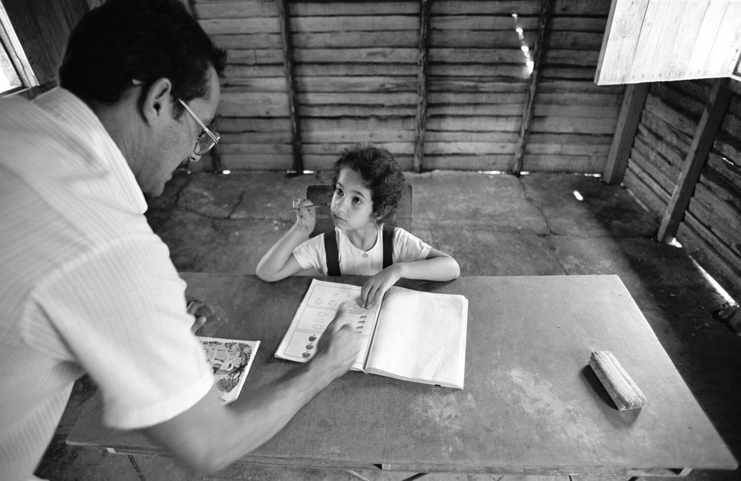  Maritza and her teacher Giraldo in the classroom of the school that was only built for her.              