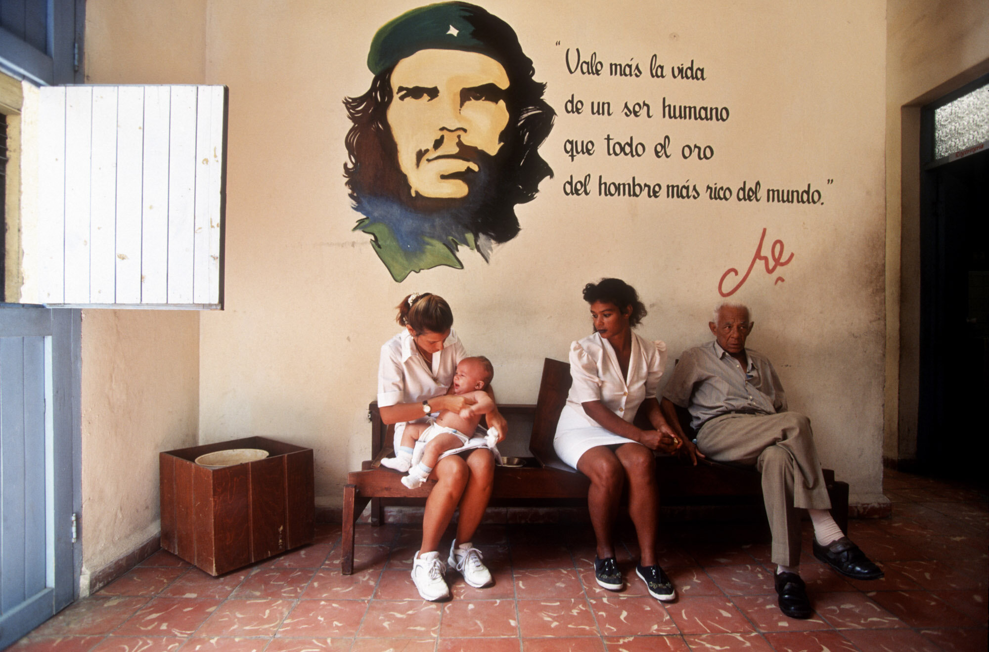  Cubans at a Medico de la Familia, Family Doctor, in Old Havana. Che Guevara painting. 