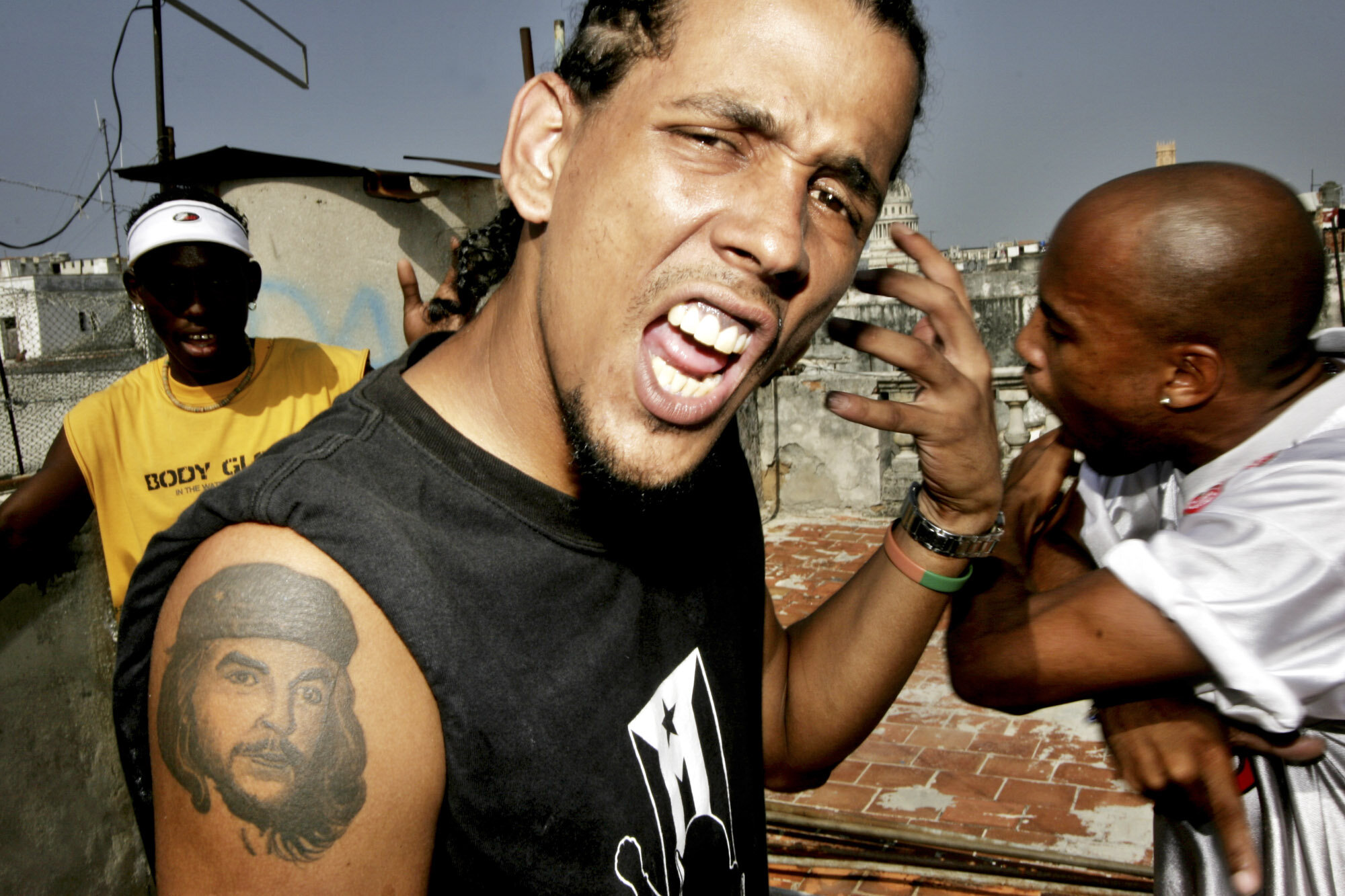  Wagner, Cuban rap musician of the band La Familia, with a Che Guevara Tattoo on his arm, during a rehearsal at a Centro Habana rooftop, 2006. 