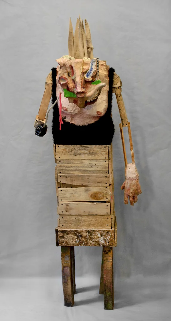 Wanderer , 84 x 29 x 32”, reclaimed wood, hardware, polymer gypsum, found objects, animal bones, animal hide, acrylic, oil, 2013