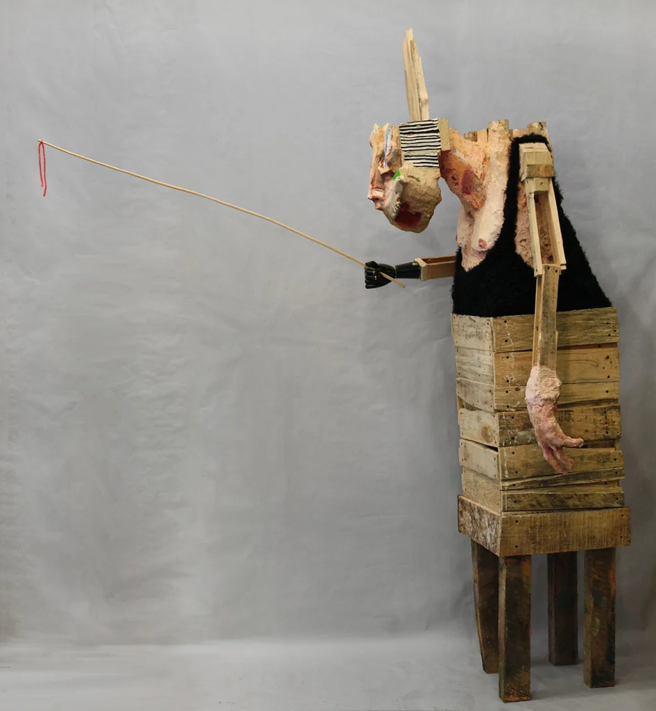 Wanderer , 84 x 29 x 32”, reclaimed wood, hardware, polymer gypsum, found objects, animal bones, animal hide, acrylic, oil, 2013