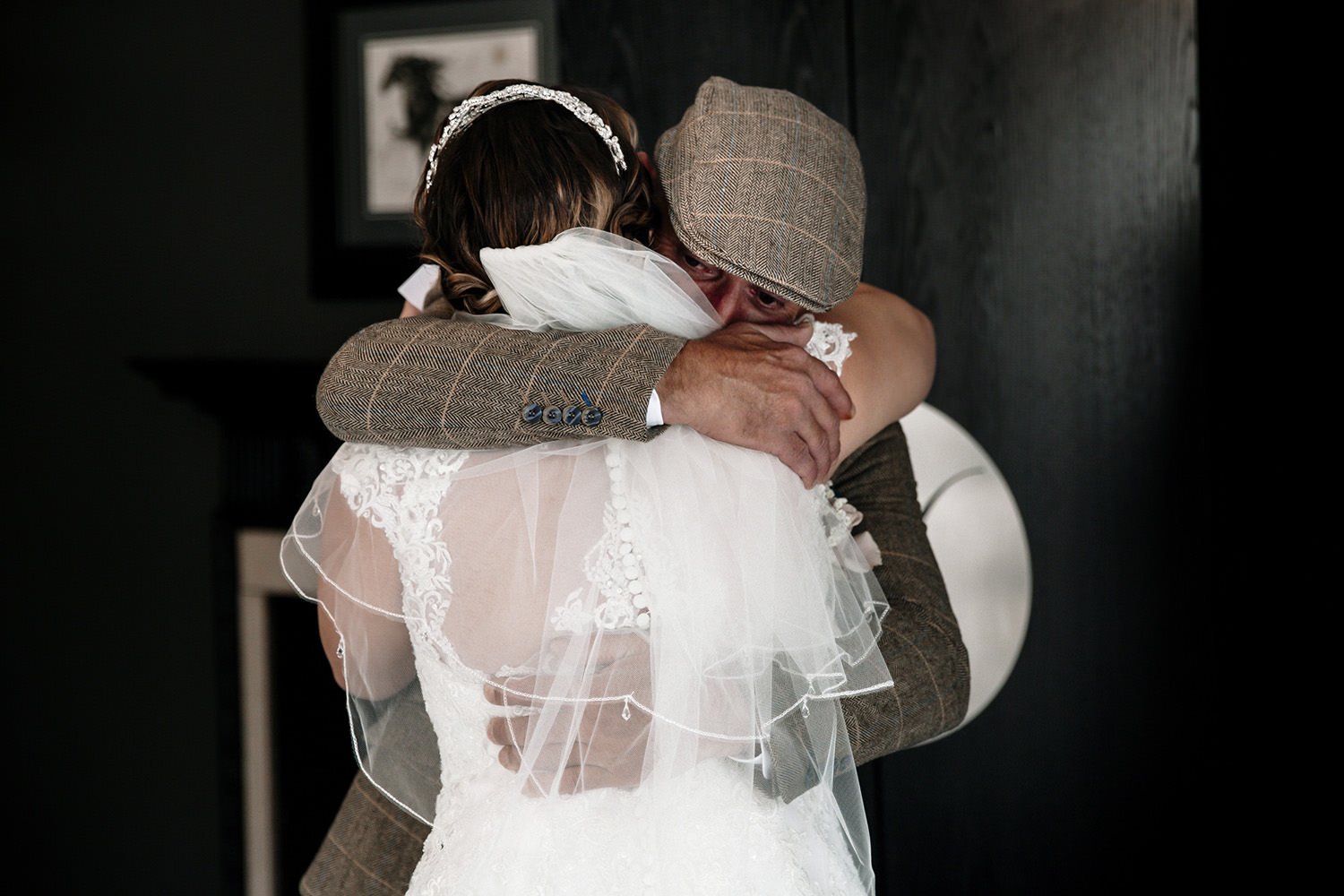 Hugging your daughter in her wedding dress for the first time