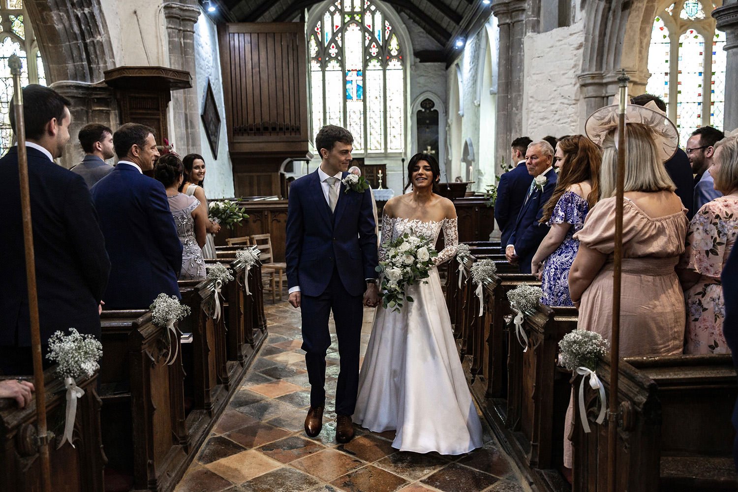 Bride and groom leaving Barrington Church