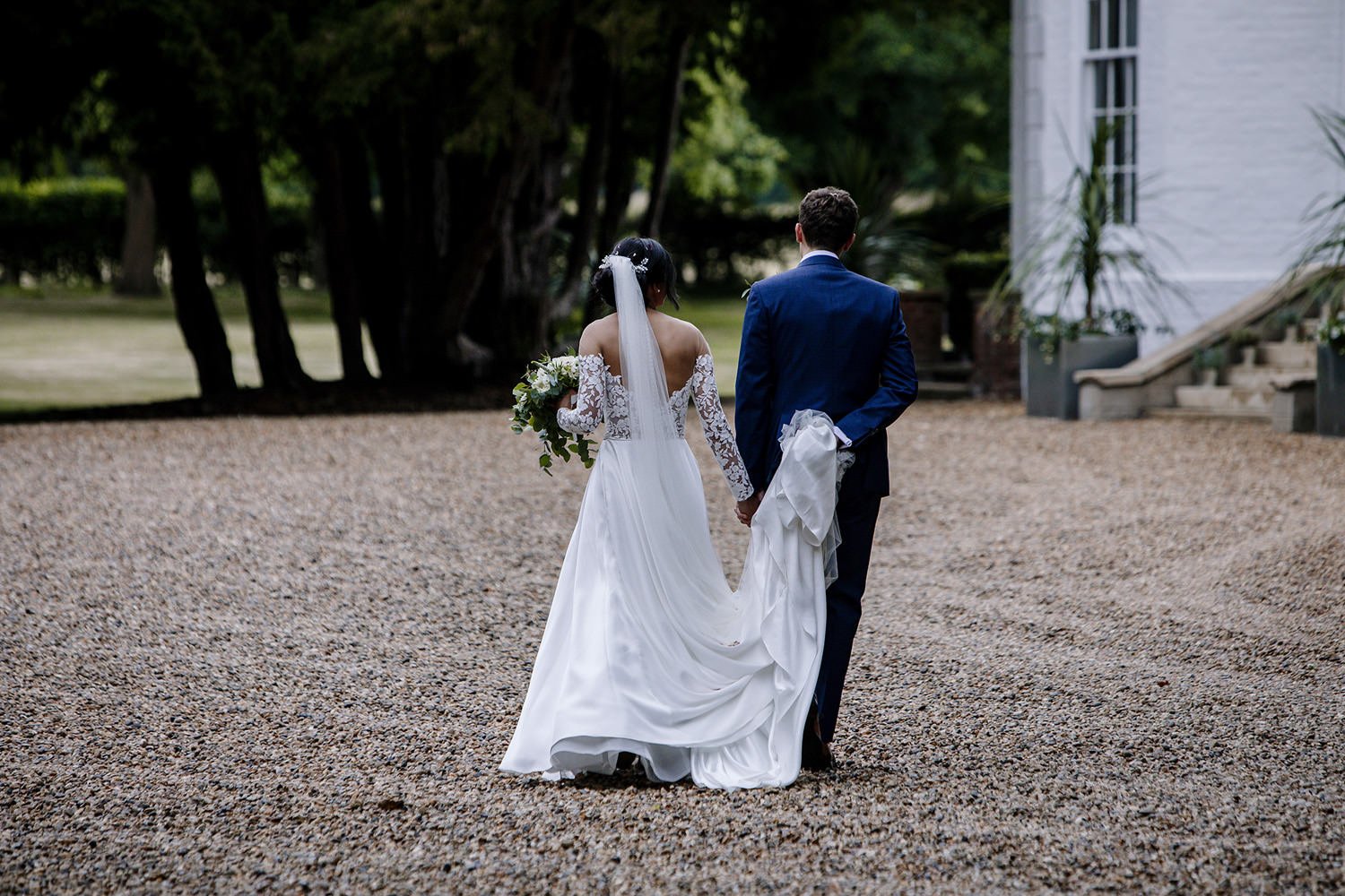 Bride and groom entering Barrington Hall