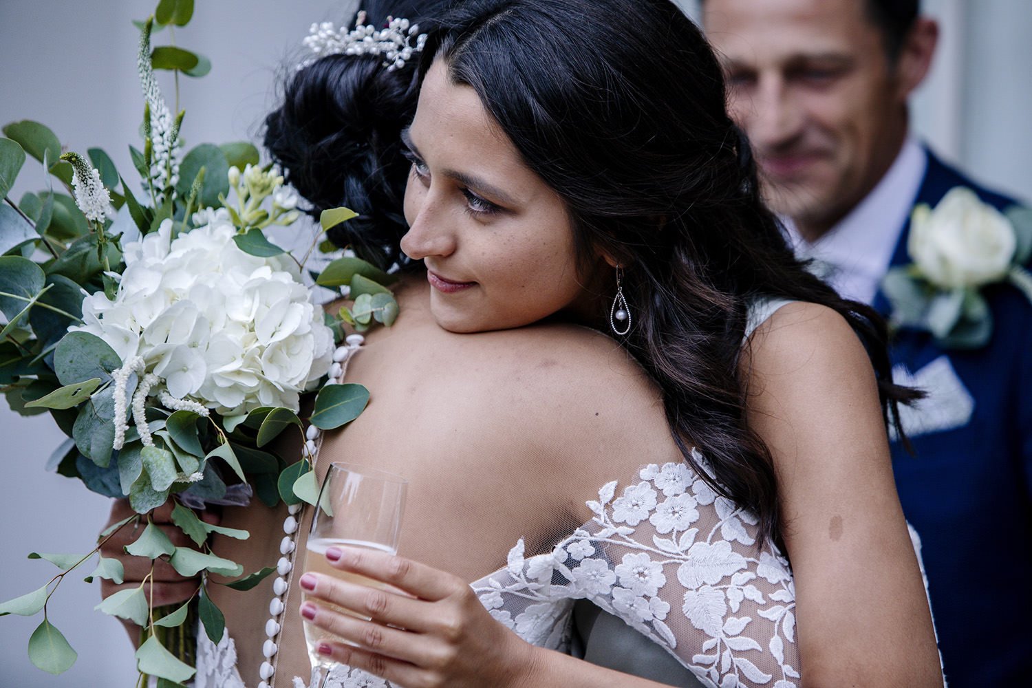 Bride hugging sister at Barrington Hall