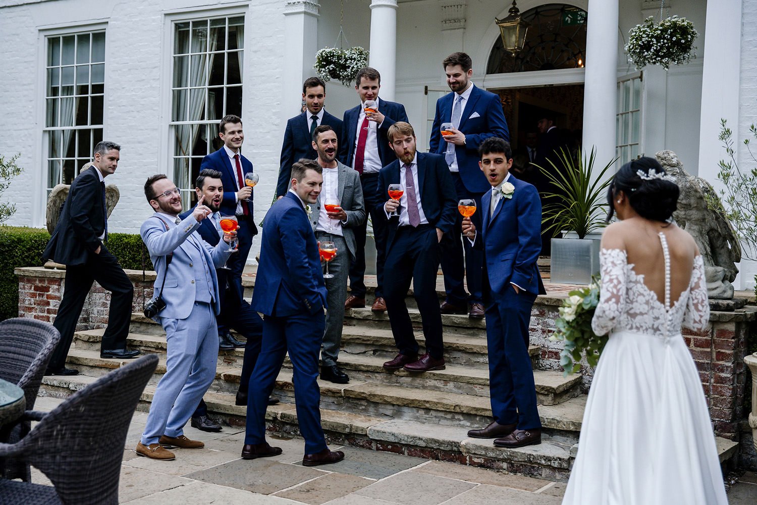 Bride chatting with the groomsmen