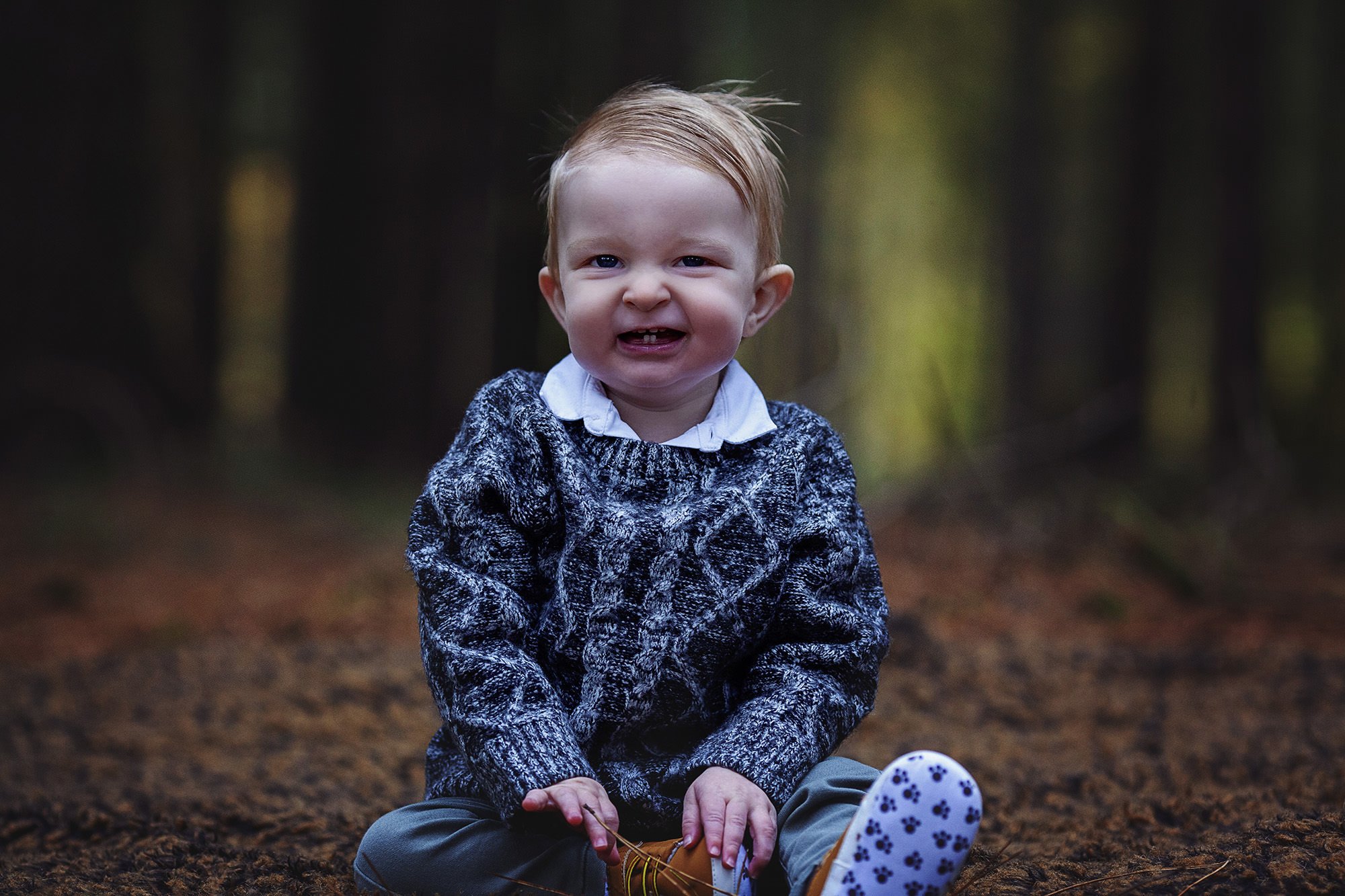 Toddler pulls funny face