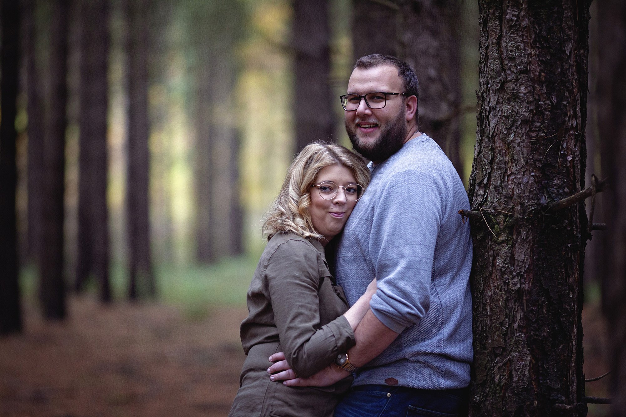 Hugging parents in conifer wood