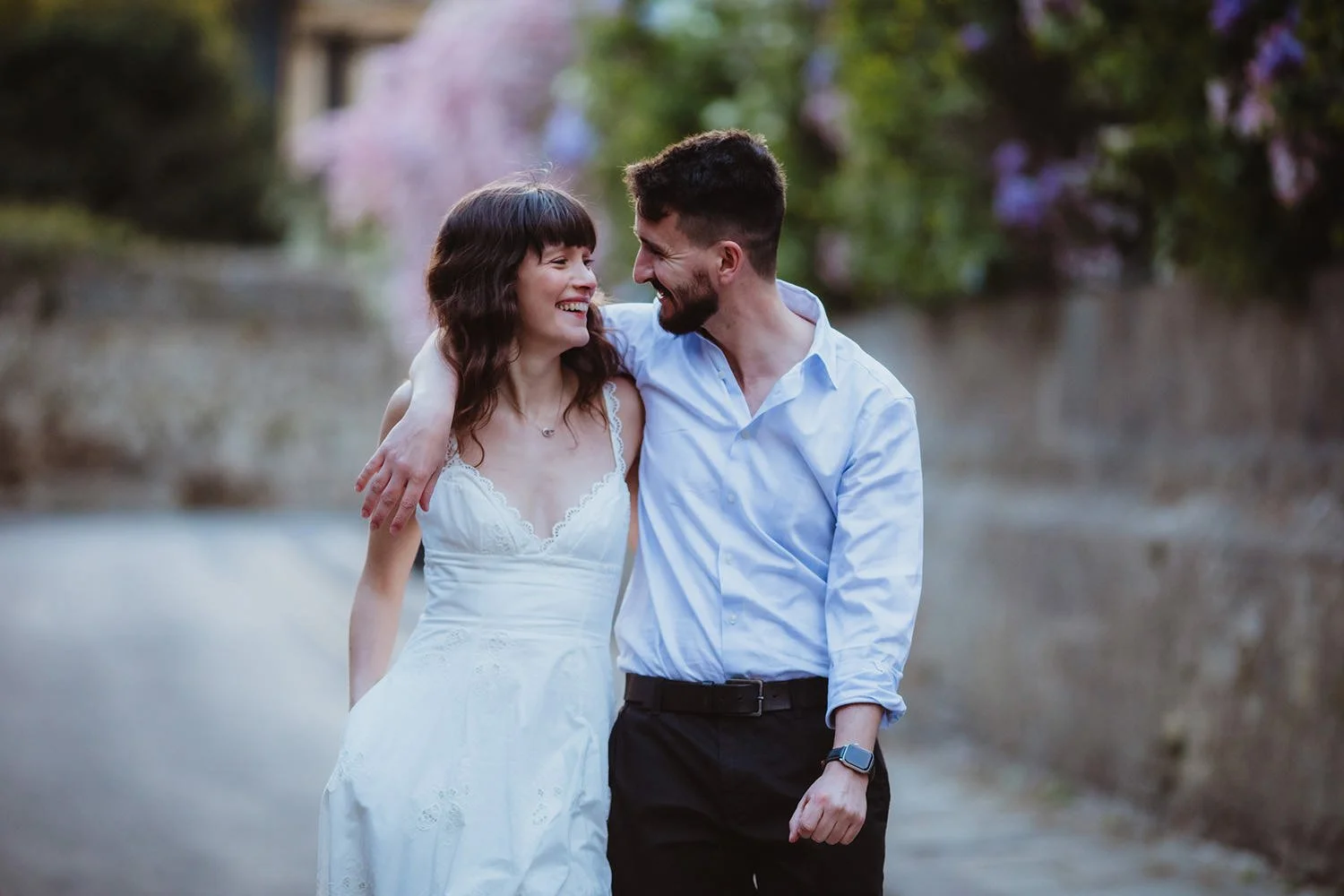 Couple walking through Oxford streets on Engagement photoshoot
