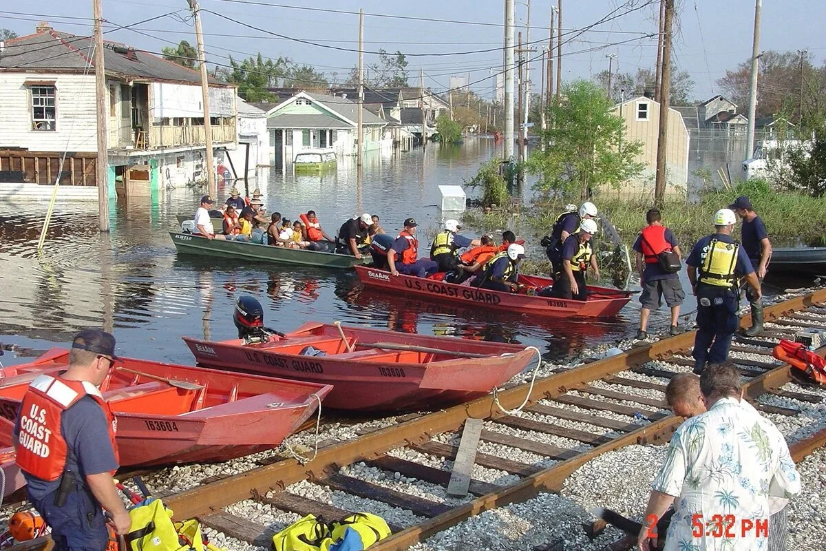 US Coast Guard rescuing civilians during Hurricane Katrina that demonstrates that compassion in action. Photo Credit: John McQuaid.