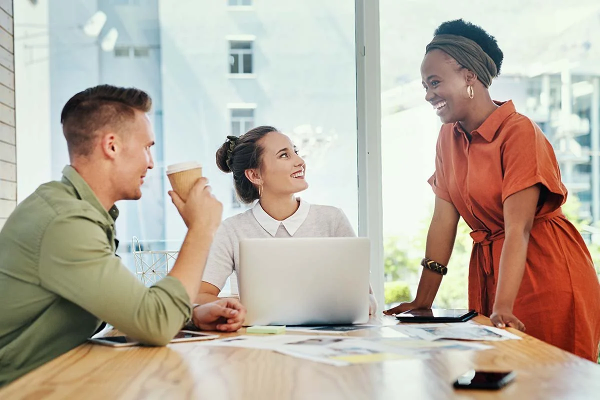 Image of coworkers interacting that demonstrates “Changing How They Show Up in Everyday Interactions” for the Center for Compassionate Leadership blog post, "How To Apply Compassionate Leadership."