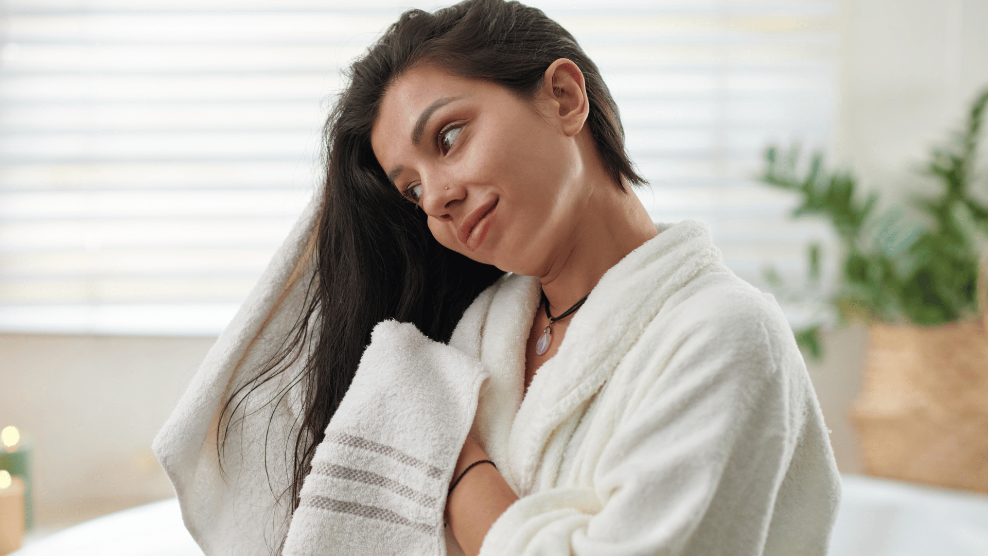 Professional blow-drying of hair extension roots and attachment points in a luxury salon