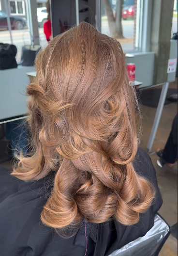 Finished hair extensions styled naturally with movement and shine using hair health focused technology at Ergun Tercan in Denver