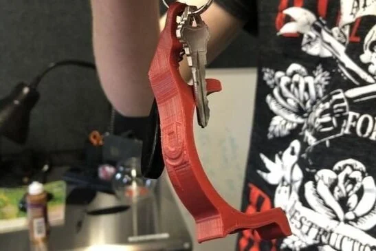 Dreamlab Industries in Michigan 3D prints antimicrobial masks and touch-less door openers