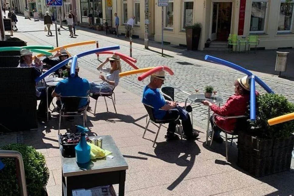 Cafe &amp; Konditorei Rothe in Germany asks its customers to wear swimming pool noodles to ensure social distancing