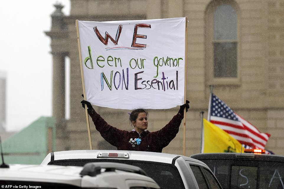 27237810-8223017-A_protester_pictured_bearing_a_sign_that_says_We_deem_out_govern-a-3_1586992930016.jpg