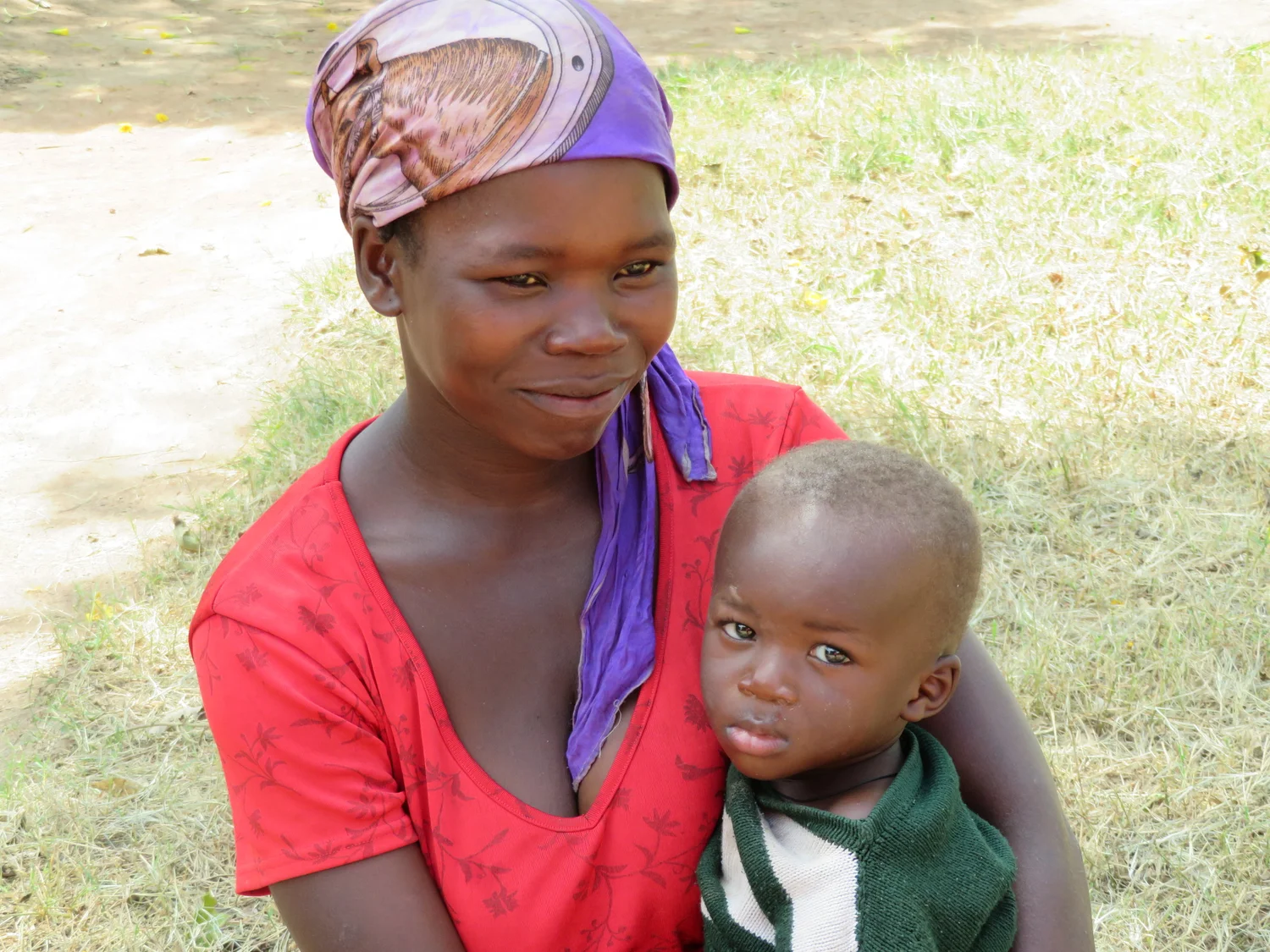 A mother in Uganda holding her young child