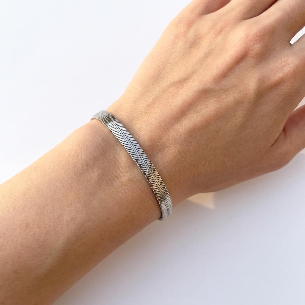 Wrist wearing wide silver flat herringbone stainless steel bracelet - waterproof jewellery - Kincha Designs London